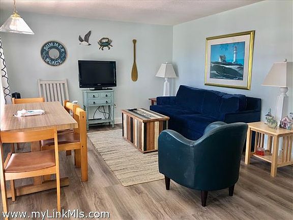Living room with dining and pullout couch-sleeps 2 new vinyl panel flooring throughout