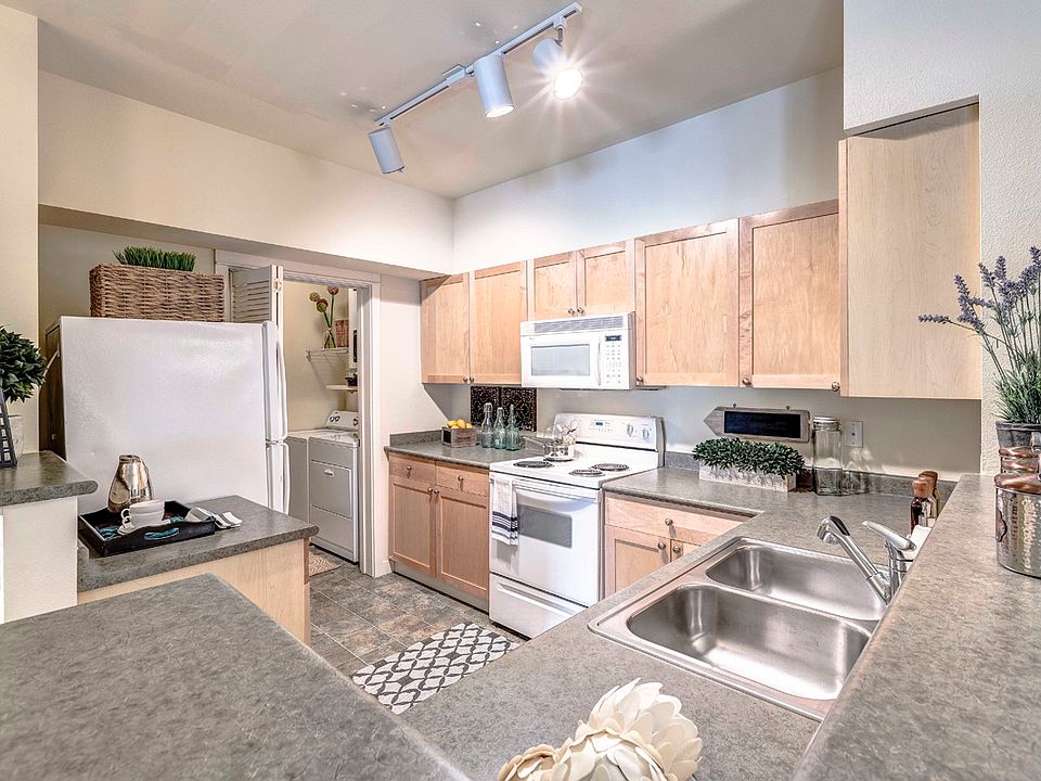 Open kitchens with energy efficient appliances, including dishwasher and mounted microwave
