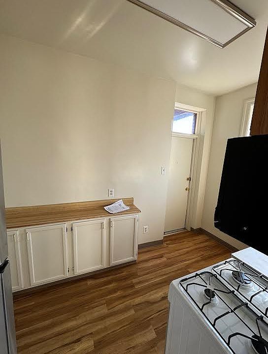 door from the balcony into the kitchen,work counter along the wall.