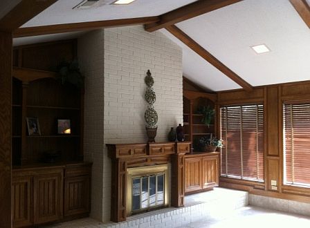 High vaulted ceiling with sunken living with new tile.Built in entertainment
