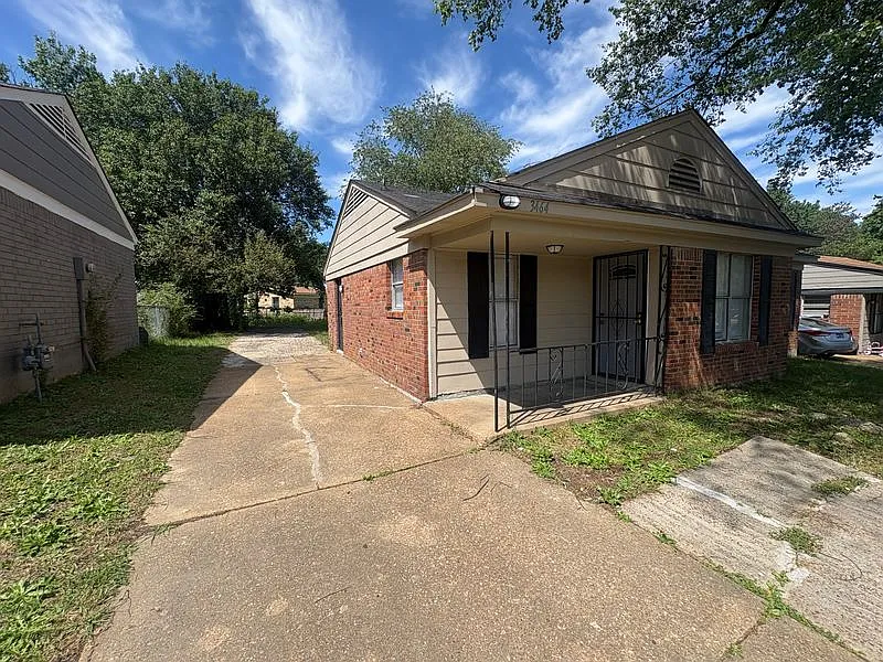 Charming Brick Home with Quaint Front Porch & Classic Layout — Photo 2