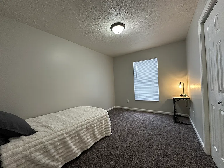 (3-Bedroom 1.5 Bath Unit)- Middle Bedroom - Freshly painted and updated carpet.