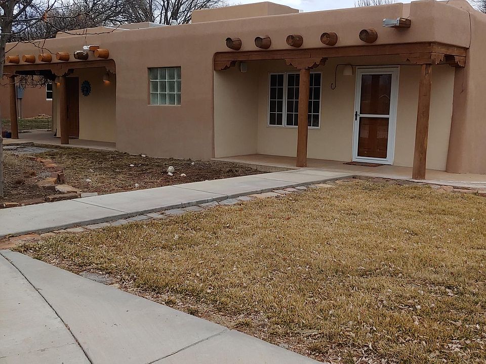 Front Door on left and front porch to Bedroom/office