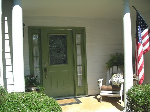 Covered Rocking Chair Front Porch opens to this well maintained & clean.      