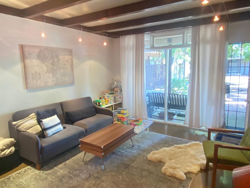 open floorpan living room with malm fireplace and floor to ceiling windows