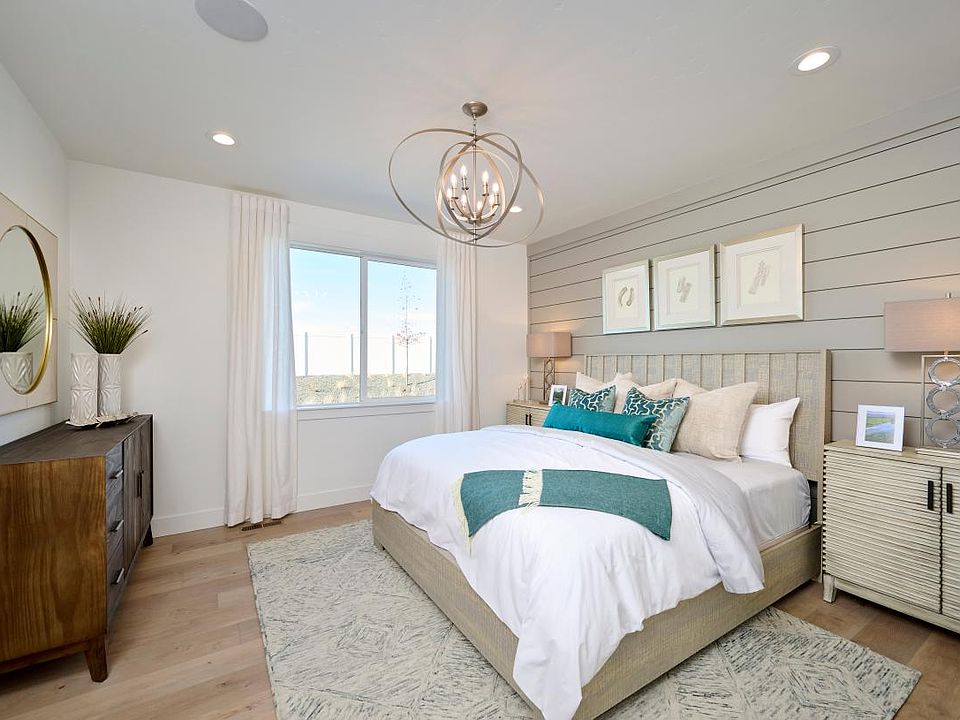 Representative Photo - Restful primary bedroom suite offers ample room to relax