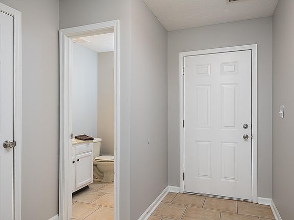 Half bath located downstairs for family and friends.