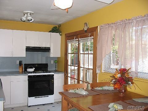 The kitchen is bright and cheery and perfect for an intimate dinner, or just having breakfast.