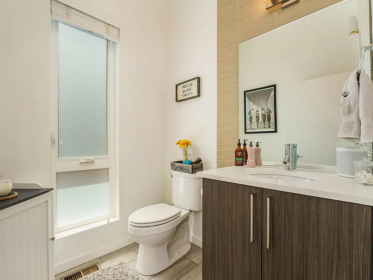 This is the restroom located on the main level and is located right when you walk in