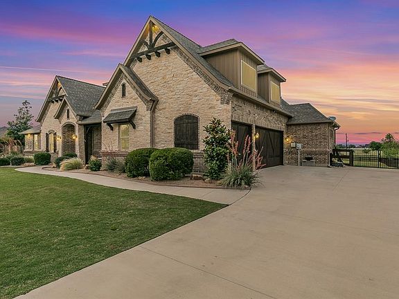View of front facade with a lawn