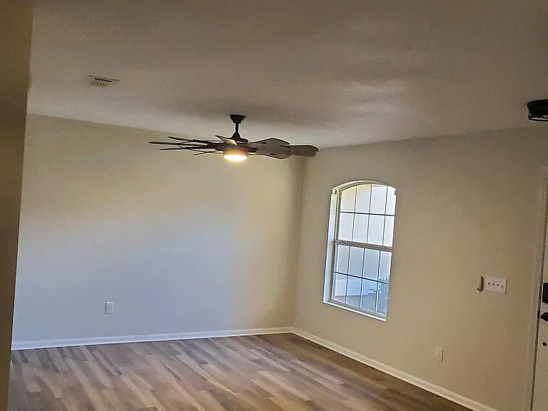 Living Room featuring Procelain Floors and Celing Fan