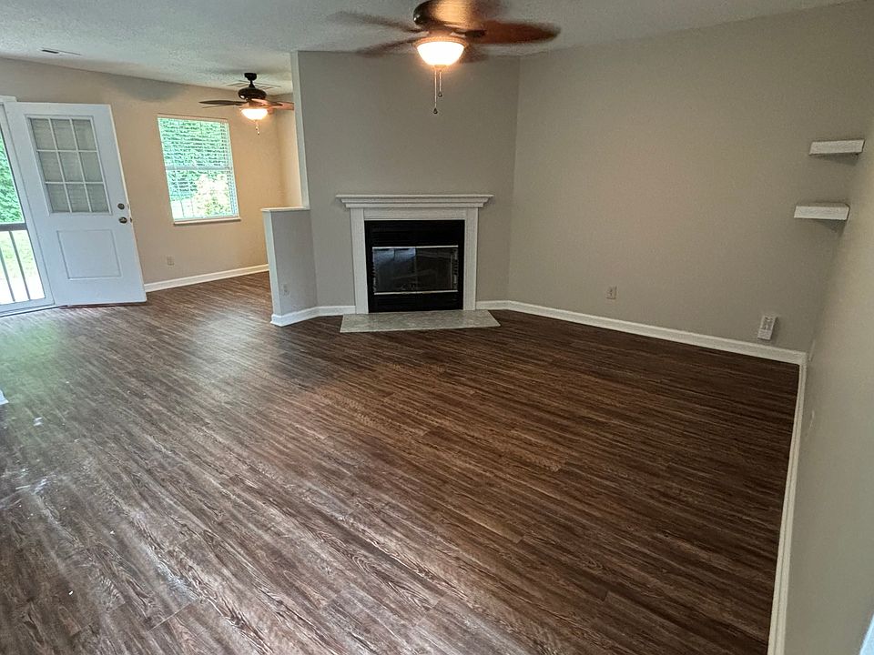Open living room and dinning area with brand new Luxury Vinyl Planks.