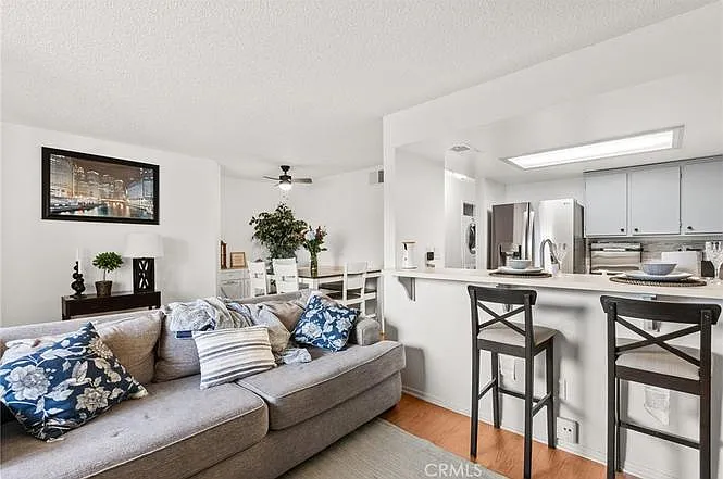 View of kitchen, dining, and living room
