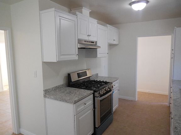 Remodeled kitchen with new cabinets and stove
