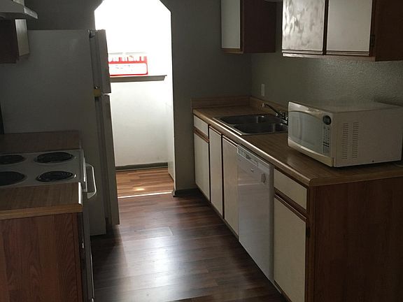 Kitchen leading to utility room with washer & dryer