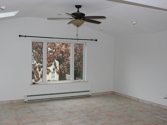 Spacious living room with skylights.