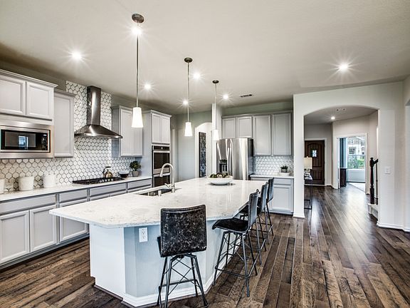 Kitchen with abundant cabinet space and recessed lighting