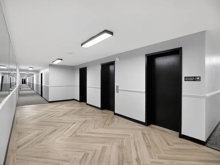 Welcome to The Jefferson, an Eagle Rock Community. Explore modern hallways featuring sleek black doors and elegant flooring designed for comfort and style. Elevate your lifestyle todayschedule a tour to see your new home!