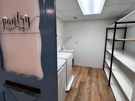 Pantry with washer, dryer, utility sink and endless storage!
