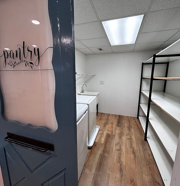 Pantry with washer, dryer, utility sink and endless storage!