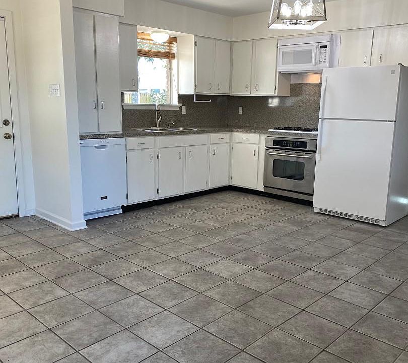 Kitchen open to Family Room and Wet Bar. window over sink looks out to rear yard.