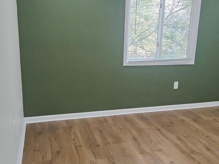 Wooden floors, recessed lights and ceiling fan