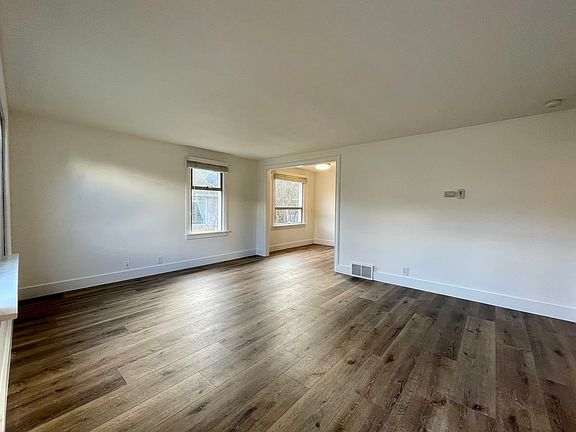 Living room flows into dining/kitchen space