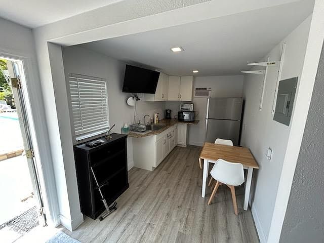 looking from bed area south to kitchenette