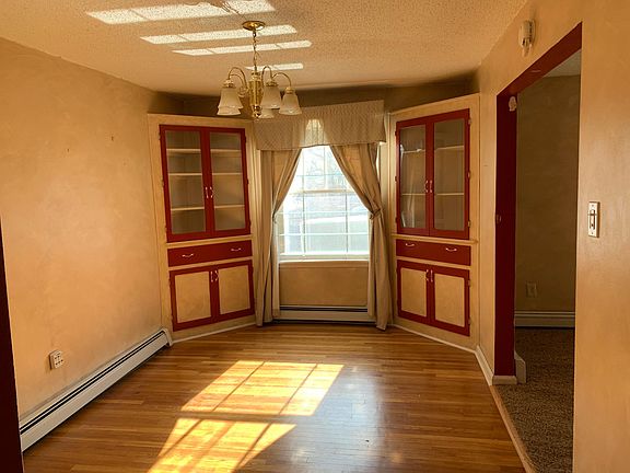 Dining room. Built-in cabinets. Oak flooring.