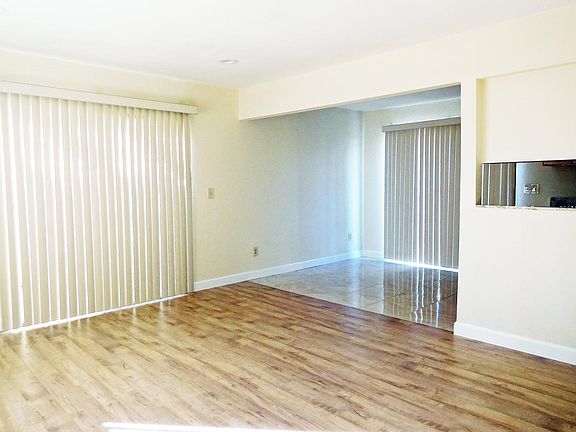 wet bar w/ quartz counter top adjoining living room; .5 bath