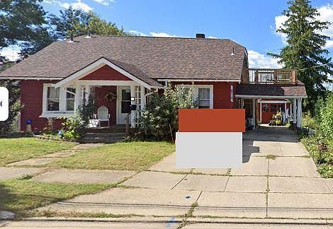 front of the house. you park in the space in front of the window, walk through the carport, and up to your deck and entrance