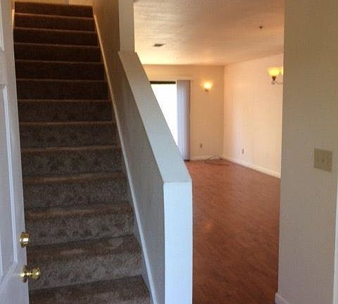 Open door to living room and stairs