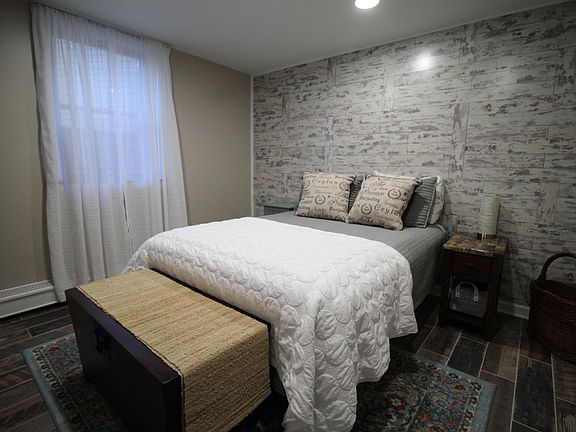 Bedroom with 2 nightstands and walk-in closet.