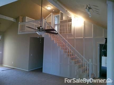 stair case with book shevles