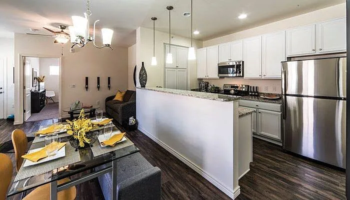 Living room, dining room, and kitchen have Shaw LPV flooring