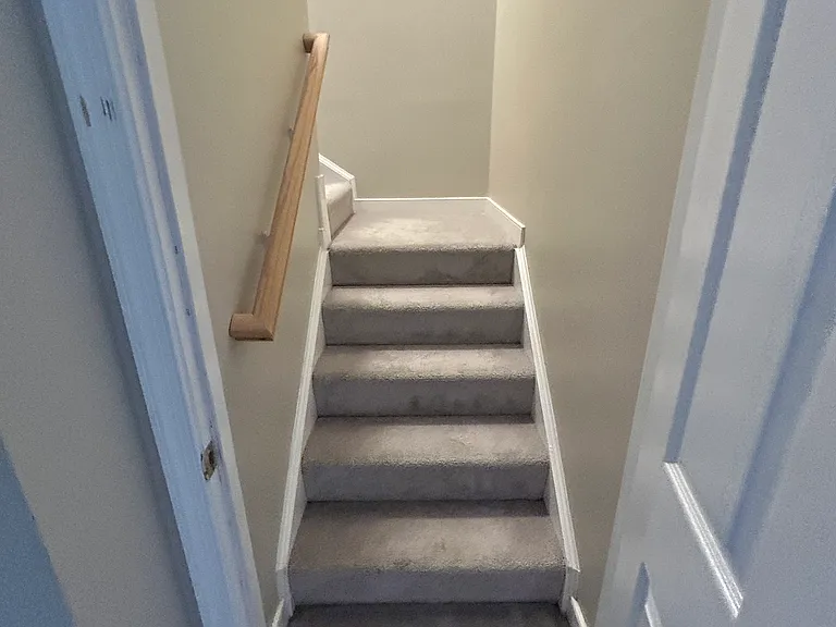Stairs to second and third floor. Carpets are two years old and will get professional cleaning at turnover.