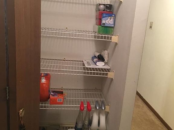 storage closet by bathroom