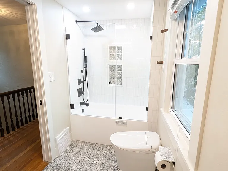 tub with custom shower doors