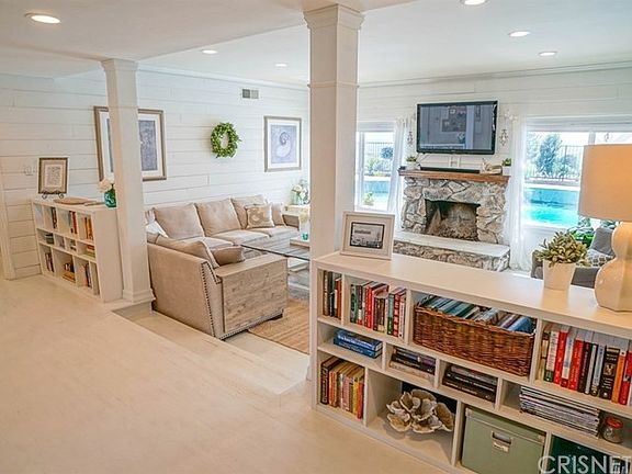 Awesome step-down living room with views of the pool & views!