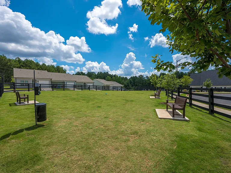 Dog park that is off to the side of the Clubhouse.