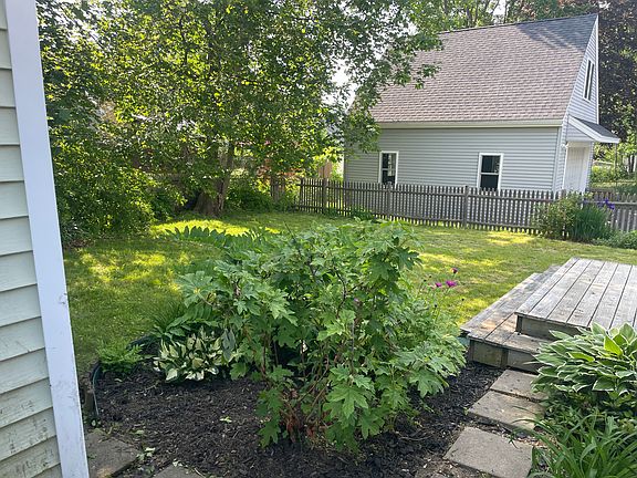 Perennial plants surround the house