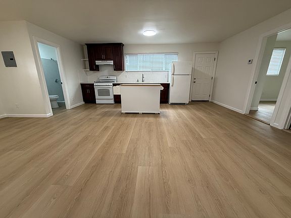 Great-room towards kitchen and front door