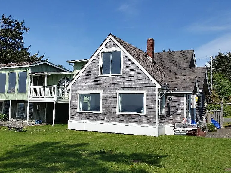 front of house showing shared garden. Pond on far left.