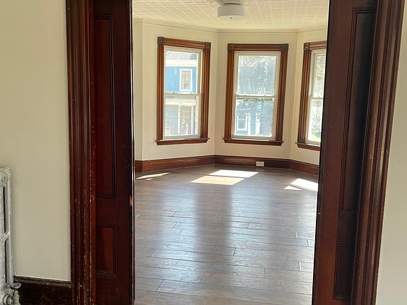 living room from dining room (separated by parlor-room doors)