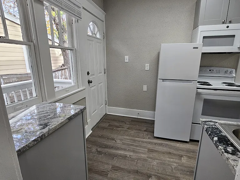 All-new kitchen with Granite Countertops and Brand-New appliances. Access to Private yard and back porch