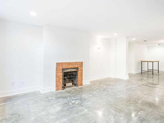 Original decorative fireplace blends perfectly with modern p