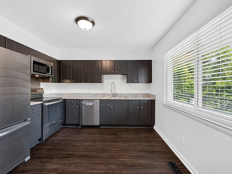 Kitchen with stainless steel appliances, & Granite Countertops