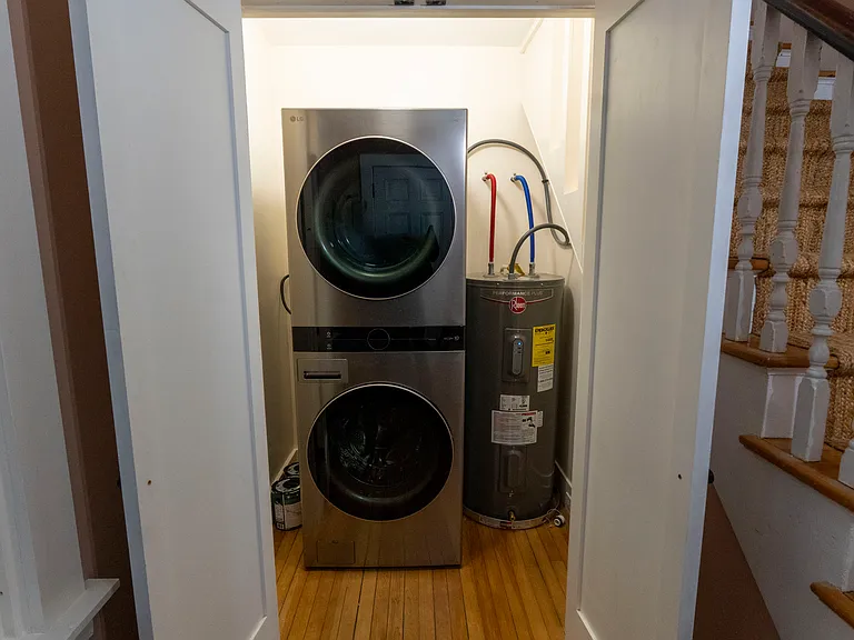 Closet includes brand new washer dryer and space for hanging coats.