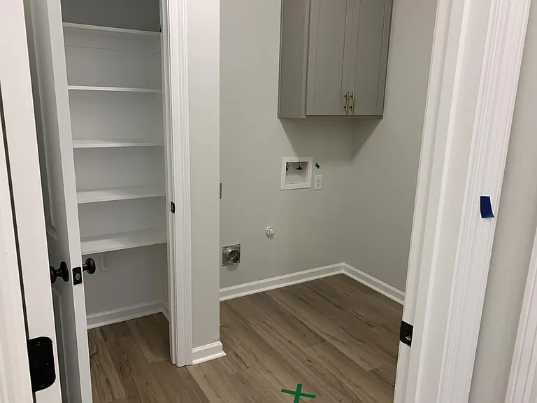 Hallway utility closet and laundry hookups