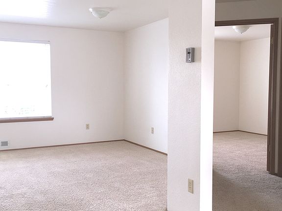 Right side of living room toward hall and bedroom.
